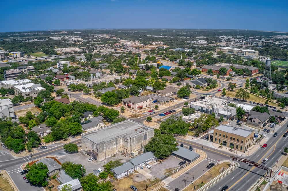 Aerial view of commercial buildings with flat roofs, ideal for roof repair or replacement.