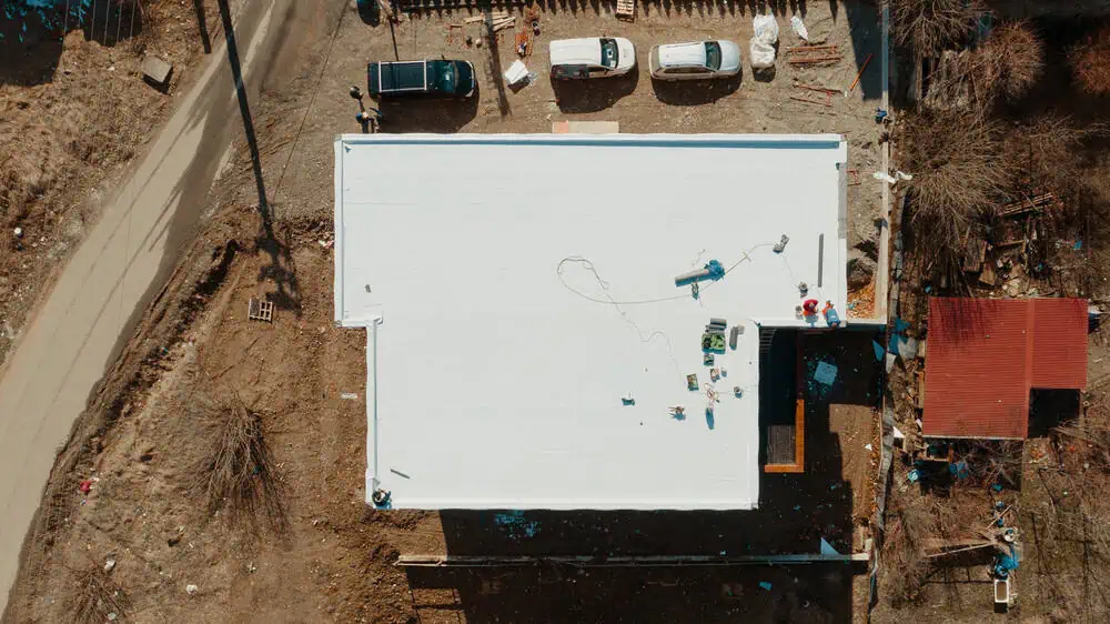 A bird’s eye view of a new commercial building with a TPO roofing system