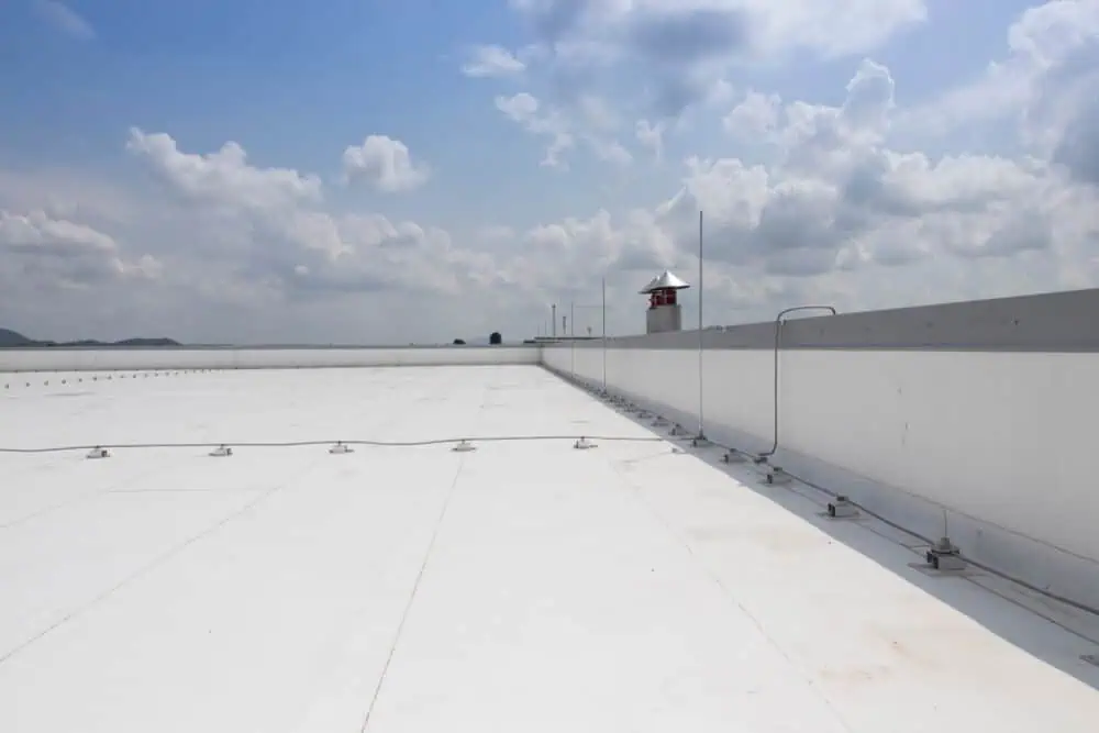 PVC roofing membrane with grounding wire on a large commercial building