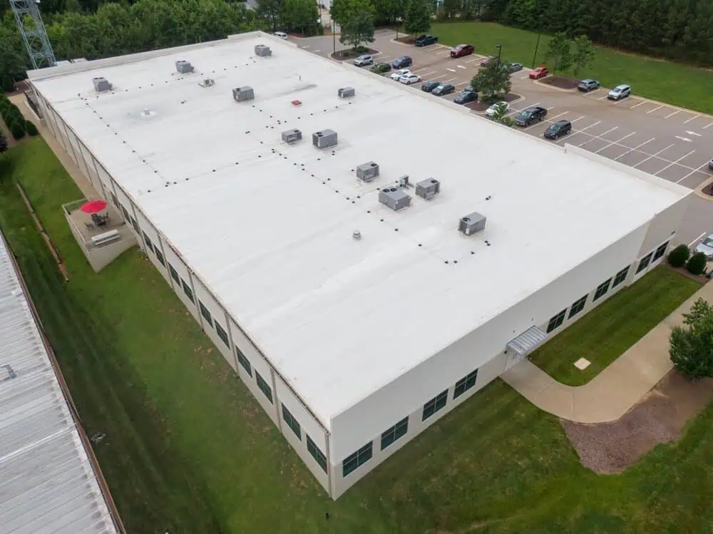 A large commercial building with a PVC membrane roofing system