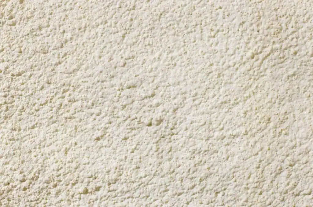 A close-up image of a spray foam roofing material